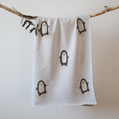 Full view of Arctic Penguins baby blanket hanging flat to show full design