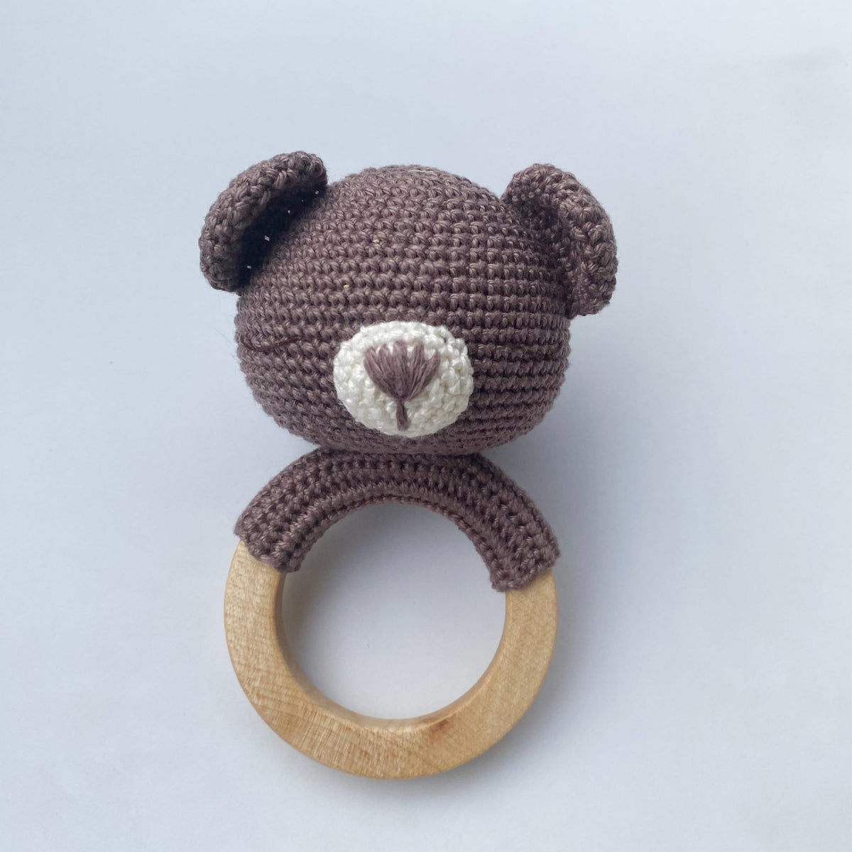 Hand-crocheted bear baby teething rattle with natural wood ring