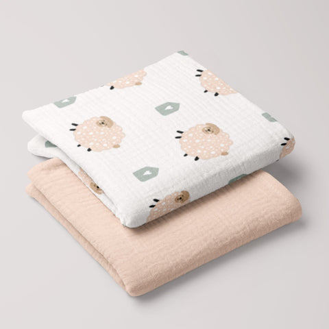Folded Fluffy Sheep muslin swaddle and cream 4-ply baby blanket set